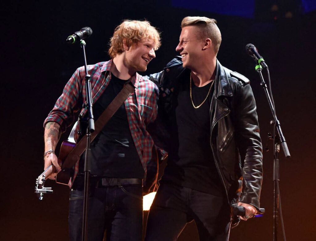 "Artiști de Renume Iau Atitudine împotriva Excluderii lui Macklemore din Turneul American al lui Ed Sheeran"